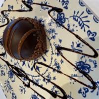 Chocolate Mousse  · Chocolate sponge cake topped with rich dark chocolate mousse and strawberry pieces,covered w...