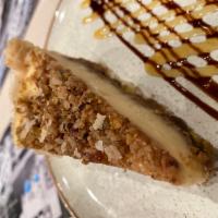 Baklava Cheesecake · A flaky buttery filo base,topped with a perfect honey and nut baklava filling,with ample vel...