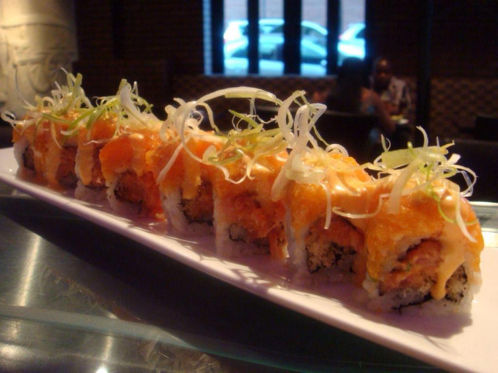 Spicy Girl Roll · Inside spicy tuna and crunch. Topped with spicy salmon and spicy scallion mayo.