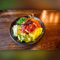 Ahi Tuna Poke Bowl · Tuna, sweet onion, cucumber, avocado, oshinko, seaweed salad with house special poke sauce.