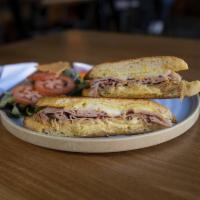 Cubano Sandwich · Marinated pork, black forest ham, Swiss, dill pickle and mustard aioli.