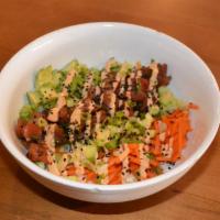 Spicy Tuna Poke Bowl · Steamed rice, cucumbers, shredded carrots, avocado, scallions, sesame soy, siracha aioli, bl...