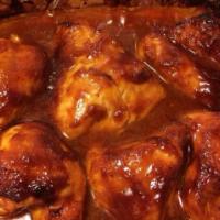 BBQ Chicken · Served with white rice or rice peas and an additional side.