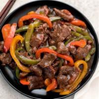 Pepper Steak · Served with white rice or rice and peas and an additional side.