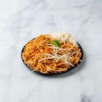 Pad Thai · Rice noodles stir-fried with egg, onions, ground peanuts, and bean sprouts.