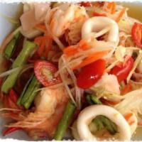 Papaya Salad with Seafood · Green papaya, tomato, carrot, peanut, and long bean in spicy lime dressing, mixed with seafo...
