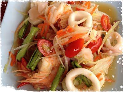 Papaya Salad with Seafood · Green papaya, tomato, carrot, peanut, and long bean in spicy lime dressing, mixed with seafood.