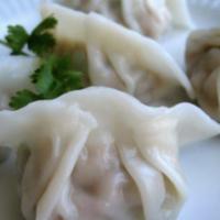 Beef Dumplings · Steam ground beef mix with vegetable served with sweet soy vinaigrette sauce.