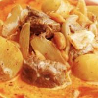 Massaman Curry Chicken · Made traditional style, with potato, onion and peanut.