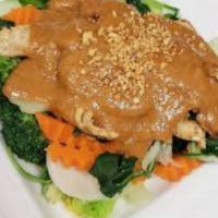 Pad Rama Peanut Shrimp. · Served on a bed of steamed vegetable and topped with peanut sauce.