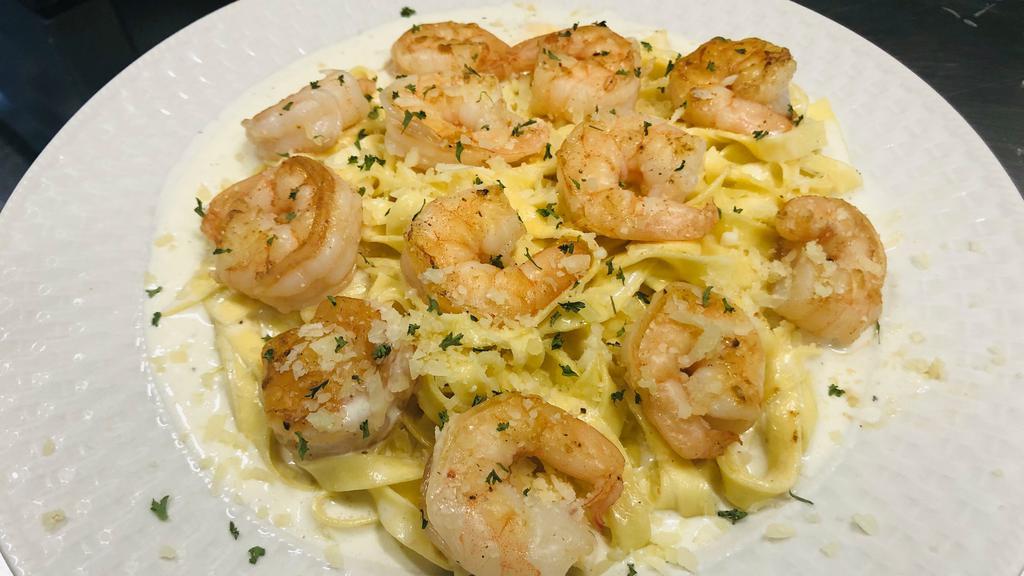 Shrimp Lovers Alfredo · 12 large shrimp on a bed of our fresh fettuccine noodles that have been tossed with our Signature Alfredo.  Our Alfredo sauce is as simple yet real as it gets, REAL Parmigiano-Reggiano and Pecorino-Romano cheese grated by us, fresh garlic, heavy cream, salt and pepper, made for you fresh individually.  Sure to please the shrimp and Alfredo lovers among us.