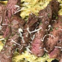Steak Pesto · Sirloin Steak on top of fresh fettuccine noodles tossed in our house made Pesto.  Our Pesto ...
