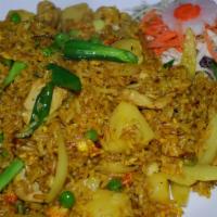 Pineapple Fried Rice · Jasmine rice stir fried with your choice of protein, pineapple chunks, onions, green peas, e...