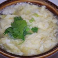 Egg Drop Soup · Clear chicken broth and lettuce finished with drop eggs and onions. 