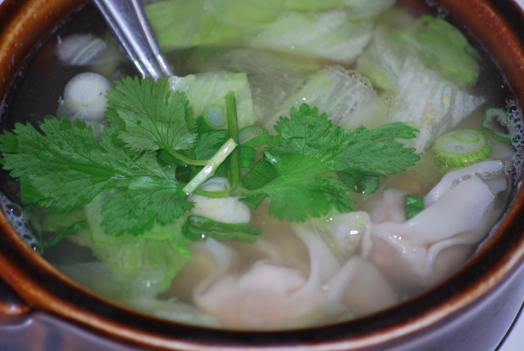 Wonton Soup · Marinated minced shrimp and chicken wrapped in wonton skin, cooked in clear chicken broth with iceberg lettuce and sprinkled with chopped onions & cilantro