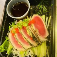Tuna Tataki · Light fried tuna and seaweed with caviar scallion ponzu sauce.