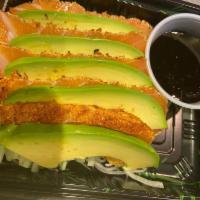 Salmon Tataki · Slice salmon and avocado with caviar scallion pozu sauce.