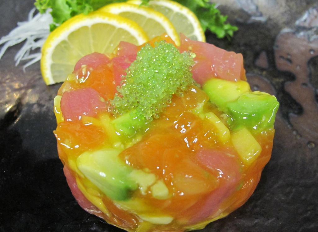 Mango Tango · Mixed tuna, salmon avocado and mango chunks with mango sauce.