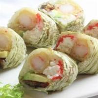 Neptune Roll · Shrimp tempura, snow crab, eel, avocado, tobiko in marble seaweed and glazed with special sa...