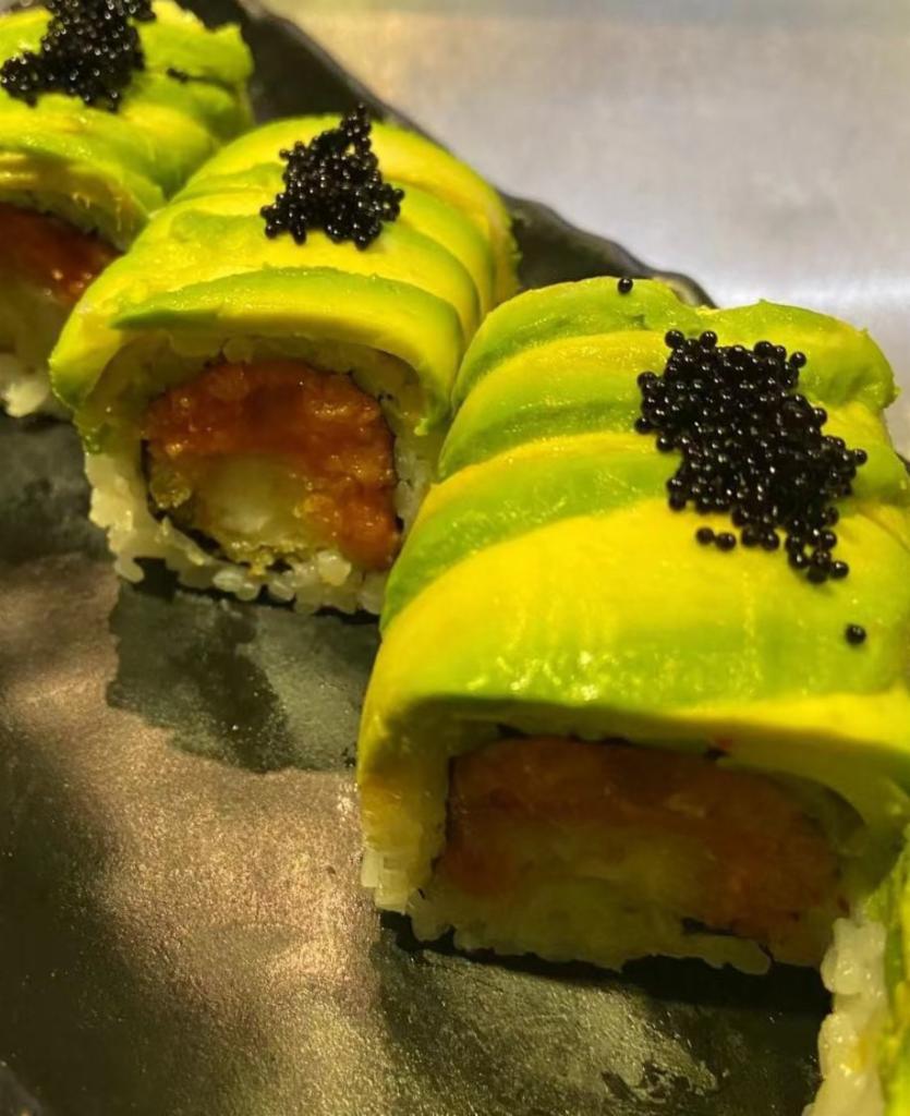 Sex on the Beach Roll · Shrimp tempura and spicy tuna inside, topped with avocado tobiko.