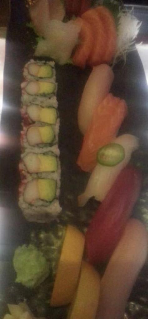 Sushi Sashimi Combo · California roll, 5 pieces sushi and 12 pieces sashimi.