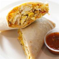 Breakfast Burrito · With 2 eggs, cheese, hash browns and choice of ham or bacon.