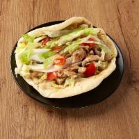 Chicken Gyros · Juicy chicken flame-roasted on a vertical rotisserie.