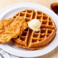 Chicken and Waffles · Breaded chicken breast and a side of warm syrup.