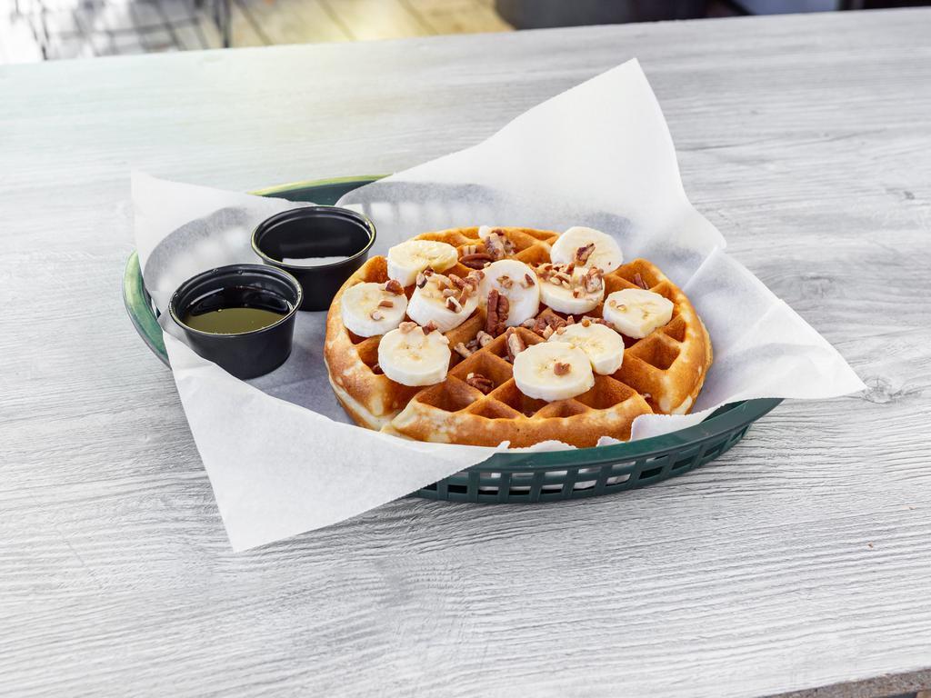 The Nutty Banana Waffle · Belgian waffle, pecans, fresh bananas, warm maple syrup, butter, and powdered sugar.