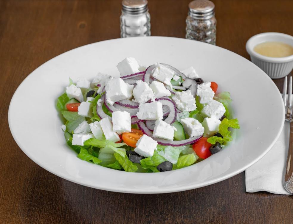 Greek Salad · Romaine hearts, cucumbers, cherry tomatoes, red onions, feta cheese, black olives and lemon olive oil dressing.