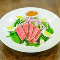 Pan-Seared Tuna Nicoise Salad · Freshly grilled tuna steak on top of baby spinach, potatoes, hard-boiled egg, black olives, ...