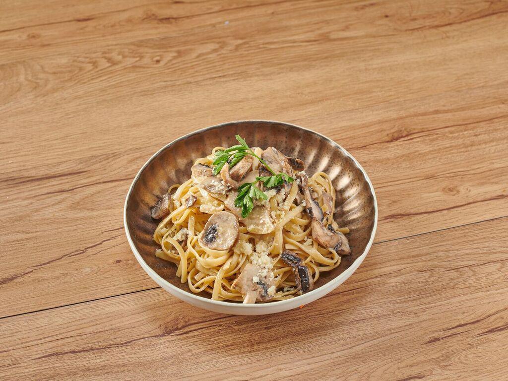 Fettuccine Alfredo · Fettuccine pasta, champignon mushroom, Parmesan cheese. Extras for an additional charge.