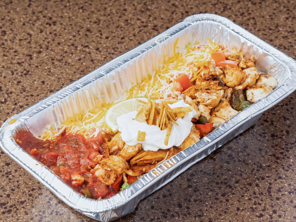 Medium Santa Fe Rice Bowl · Feeds 1-2. Fajita chicken, tomatoes, romaine lettuce, spinach, green and red peppers, onions, and salsa roasted corn fried tortillas strips. 
