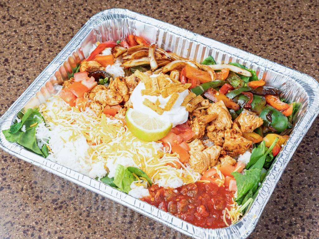 Large Santa Fe Rice Bowl · Feeds 2-3. Fajita chicken, tomatoes, romaine lettuce, spinach, green and red peppers, onions, and salsa roasted corn fried tortillas strips. 
