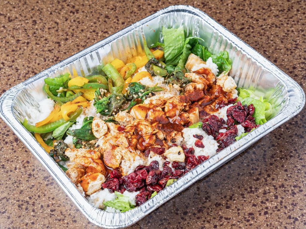 Large Cran Jerk Rice Bowl · Feeds 2-3. Dried cranberries garlic roasted spinach green and yellow peppers pan-seared chicken breast with Jamaican jerk BBQ on top. 