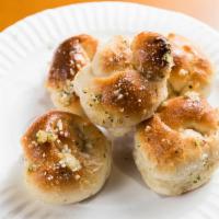 Garlic Knots 5 Pieces  · Rolled baked garlic bread. 