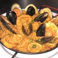 Seafood Paella · Rice mixed and sauteed clams, octopus, mussels, shrimp and calamari.