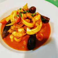 Picante de Mariscos · Sauteed shrimp, clams, octopus, mussels and calamari with white wine, garlic and onions in a...