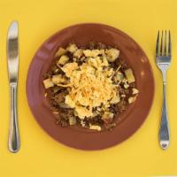 Eggs over Turkey Hash · Fluffy scrambled cage free eggs served over a housemade turkey sausage and potato hash with ...