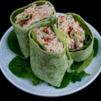 Chicken Salad Spinach Wrap · Utopia's chicken salad with with fresh Roma tomatoes and crisp lettuce rolled in a spinach f...