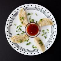 Chicken Pot Stickers · Asian style dumplings served with a side of Thai sweet chile sauce.
