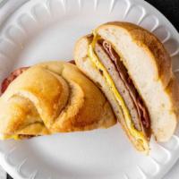 Grand Slam · Sausage, bacon, ham and cheese and egg on a hard roll.