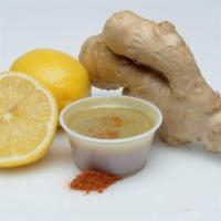 Lemon Ginger Shot · 2 oz. Fresh lemon, raw ginger, dash of cayenne. 31 cal.