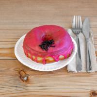 Hibiscus Doughnut · Sweet and tangy glaze made with dried Mexican hibiscus, topped with candied hibiscus flower