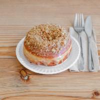 Cafe au Lait Doughnut · Inspired by a classic coffee cake made with a roasted coffee glaze and crunchy pecan topping
