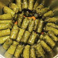 Vegetarian Grape Leaves (Vegan and GF) · Rolled with rice, parsley, onions, tomatoes with lemon and olive oil.