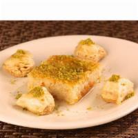 Harissa · A semolina coconut cake soaked in rosewater syrup and topped with pistachio.