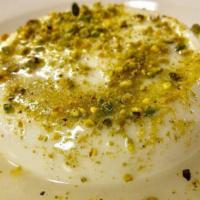 Sahlab (Custard) · Sweet mastic flavored custard garnished with pistachios and rosewater syrup.
