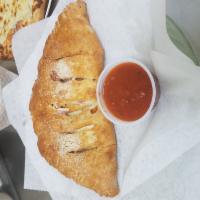 Cheese Calzone · Mozzarella and ricotta cheese, add toppings for an additional charge. 
