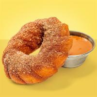 Churro Doughnut · Cinnamon sugar dusted churro doughnut with dulce de leche.